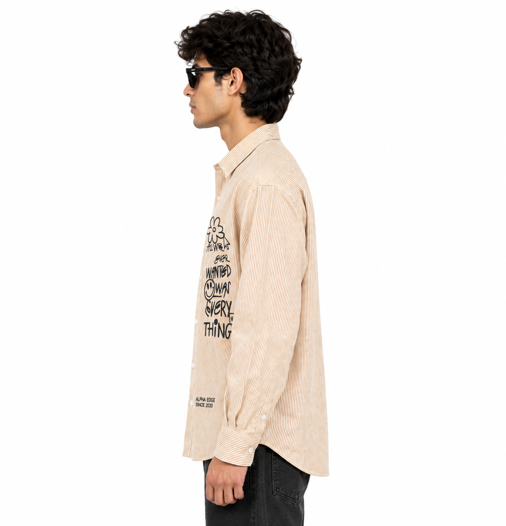 Side view of beige striped graphic boxy-fit shirt