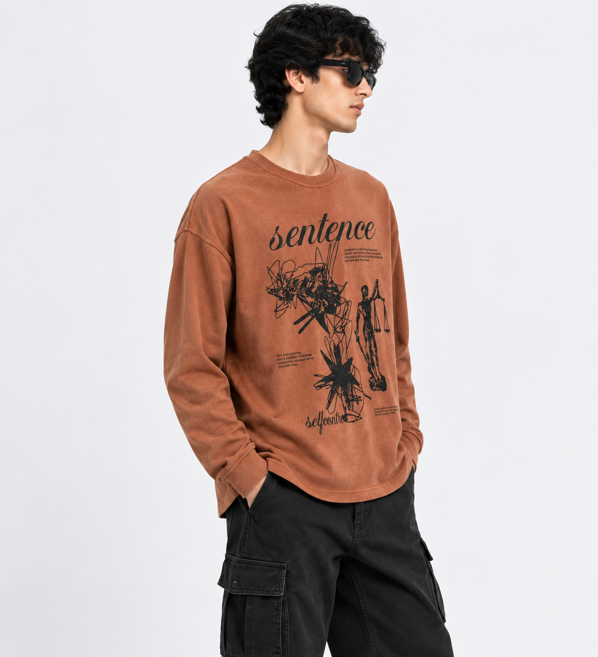 Angled view of rust graphic long-sleeve T-shirt
