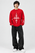 Front view of red long-sleeve T-shirt with white thorn-like graphic